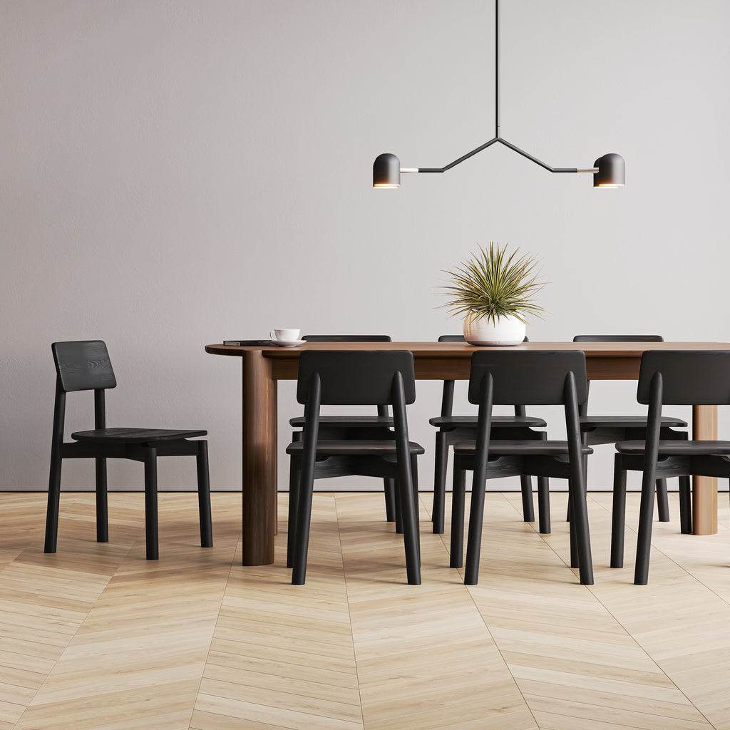 Dining table with black chairs in a modern room