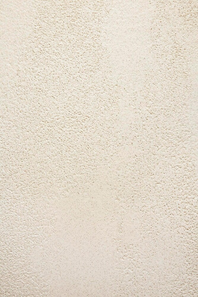 Close-up of a textured beige fabric surface