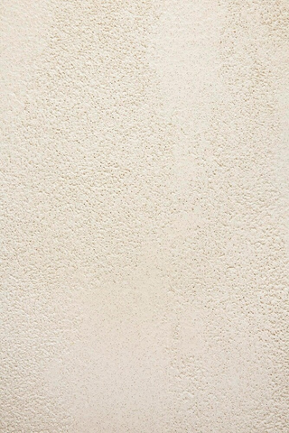 Round white table with a white base on a light gray background