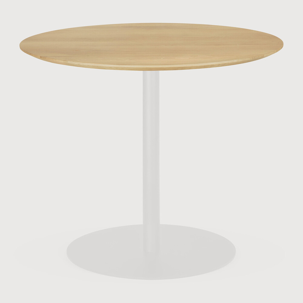 Round wooden table with a white base on a light gray background