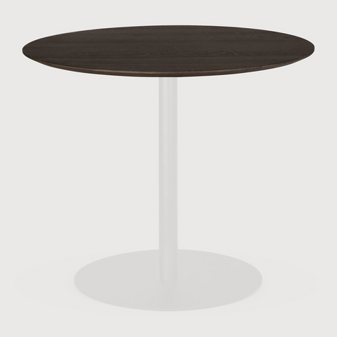 Round wooden table with a white base on a light gray background