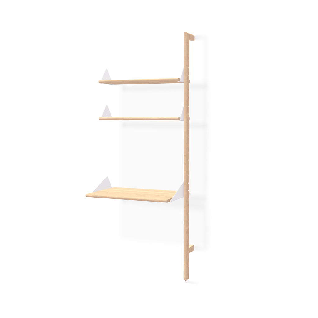 Wooden shelf with white triangular brackets on a white background
