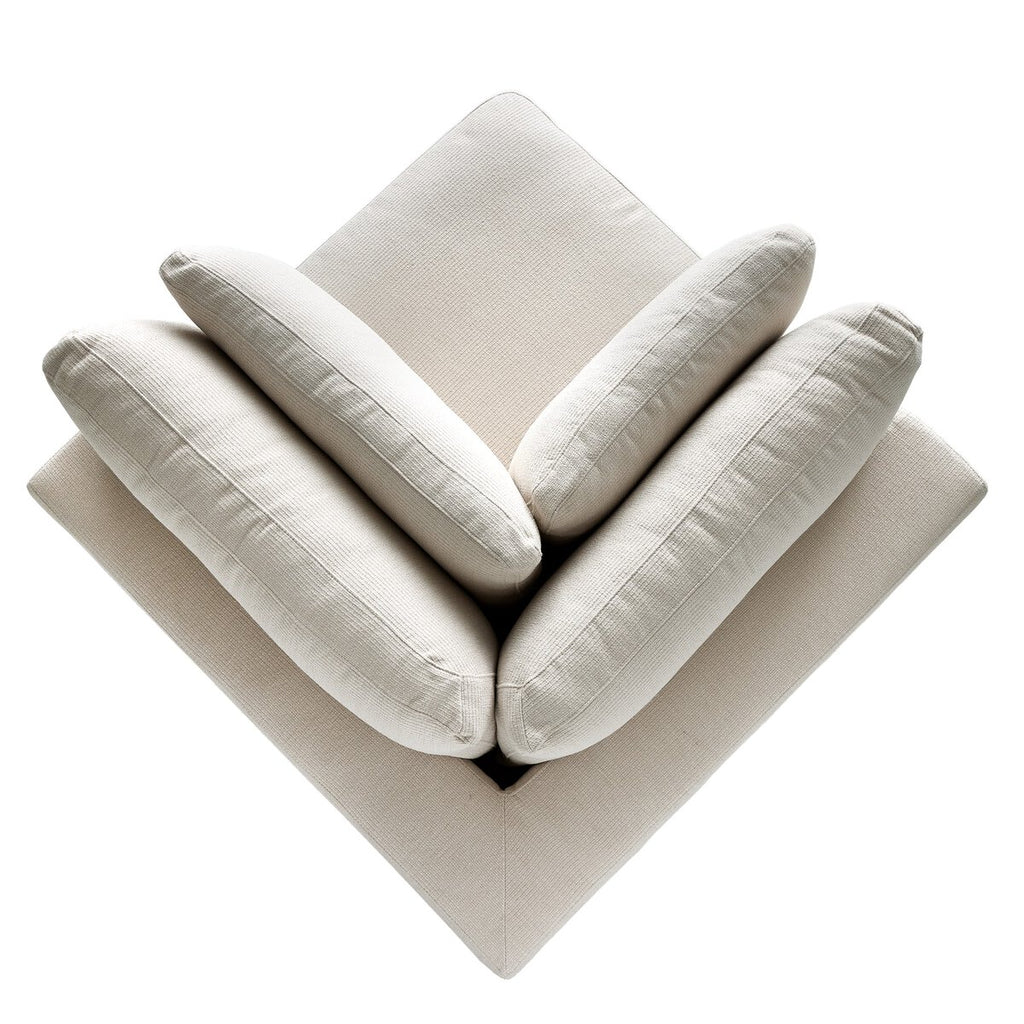 Beige corner sofa with cushions on a white background