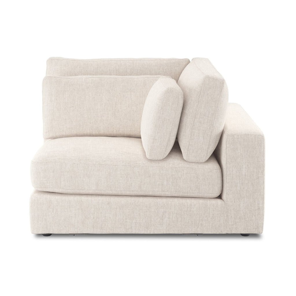 Beige sofa with cushions on a white background