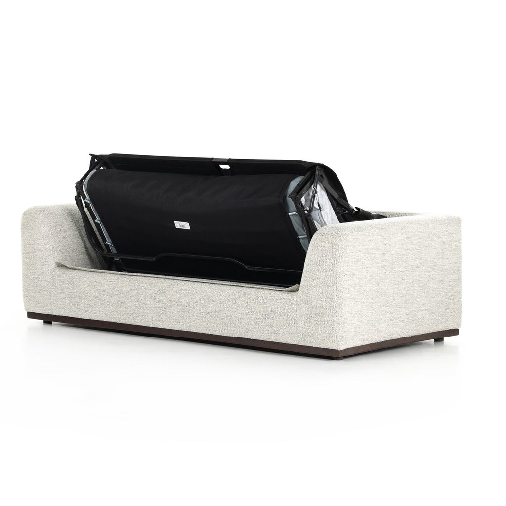Modern white sofa with a black screen or panel on a white background