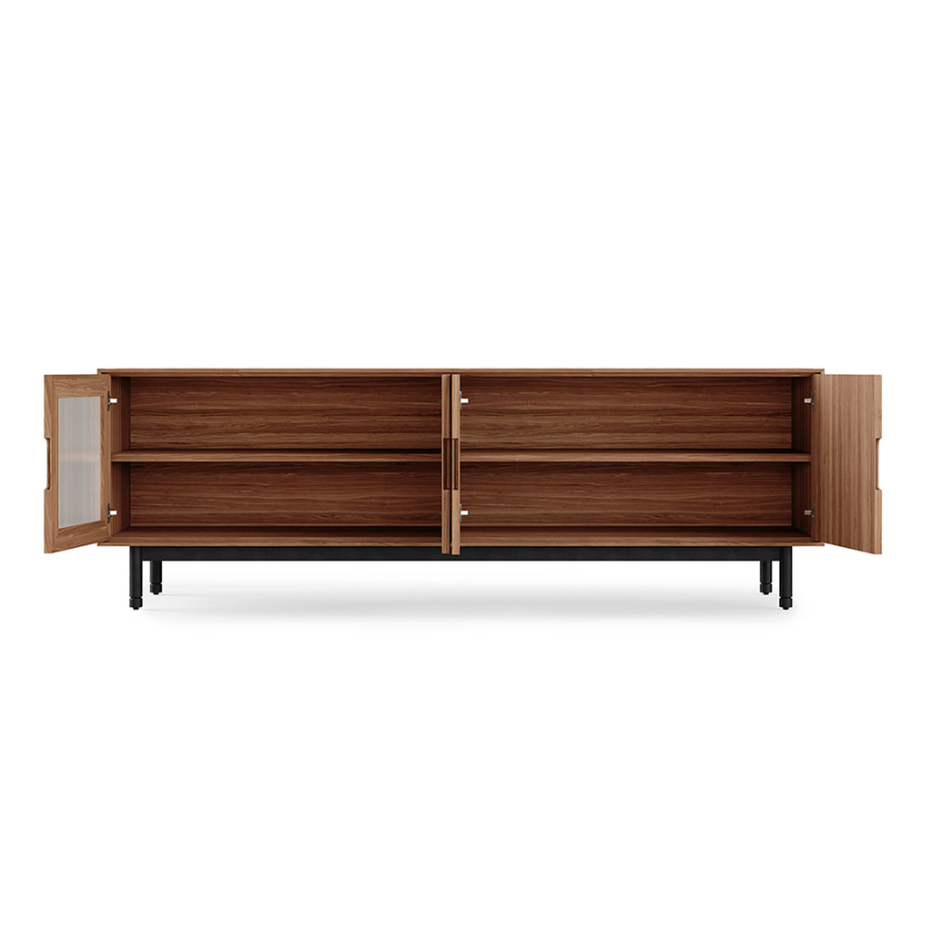 Wooden sideboard with open doors on a white background