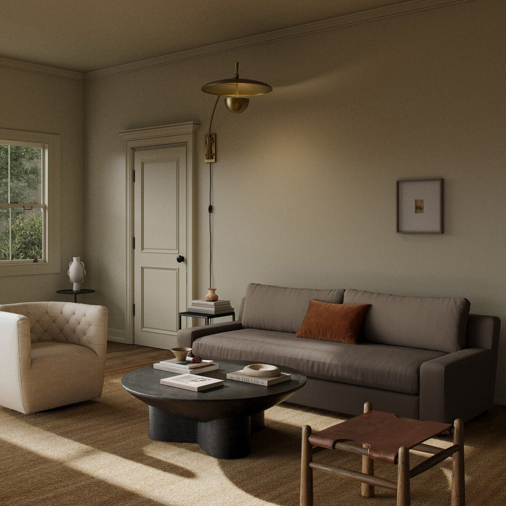 Brown sectional sofa on a wooden floor with a rug