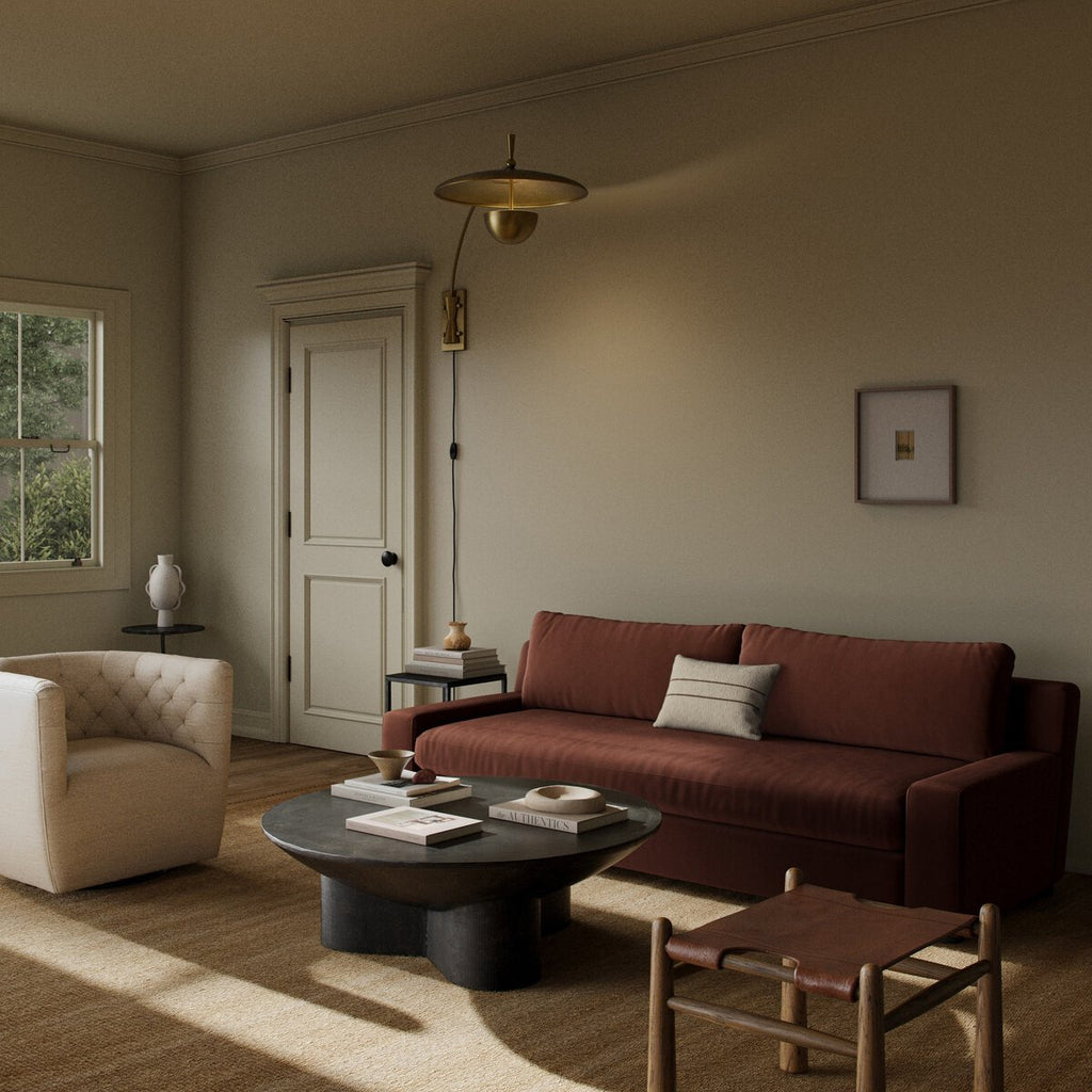 Cozy living room with a brown sofa, armchair, and coffee table.