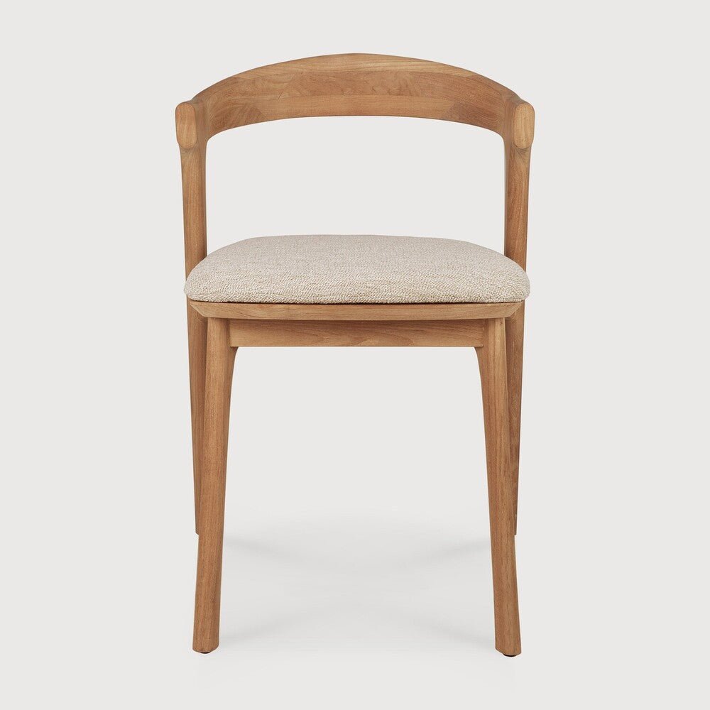 Wooden chair with a beige cushion on a white background