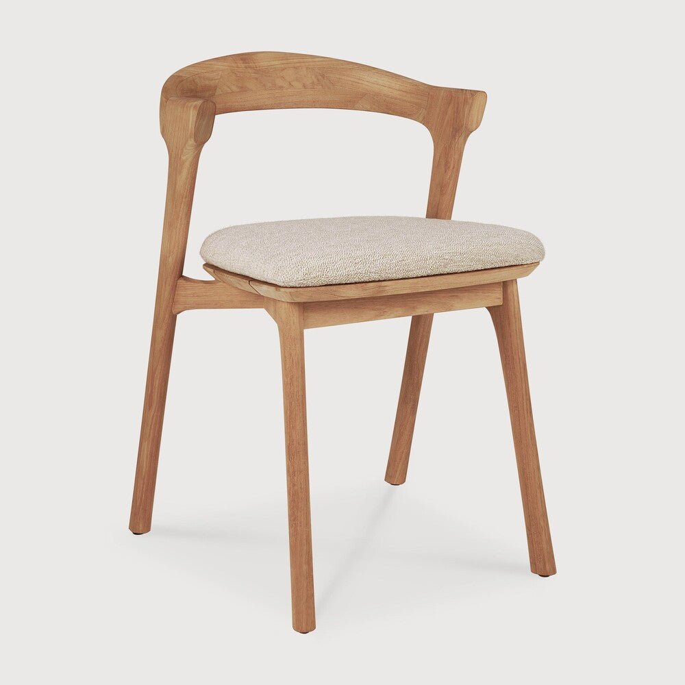 Wooden chair with a cushioned seat on a white background