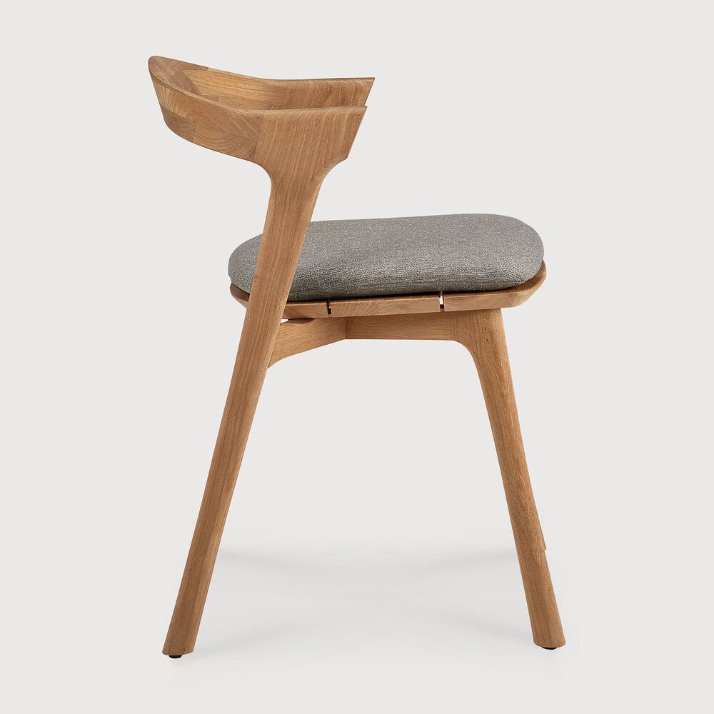 Wooden chair with a gray cushion on a white background