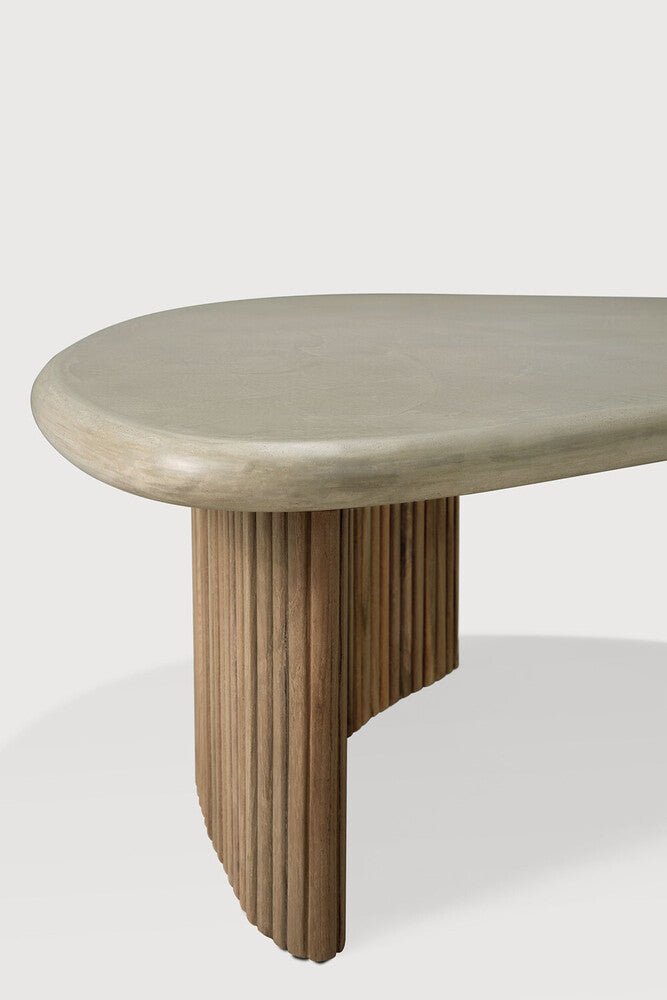 Modern coffee table with a stone top and wooden base on a white background