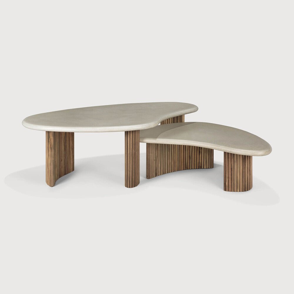 Two-piece coffee table with wooden legs and beige top on a white background