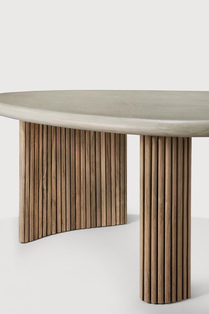 Modern table with a light gray top and wooden legs on a white background