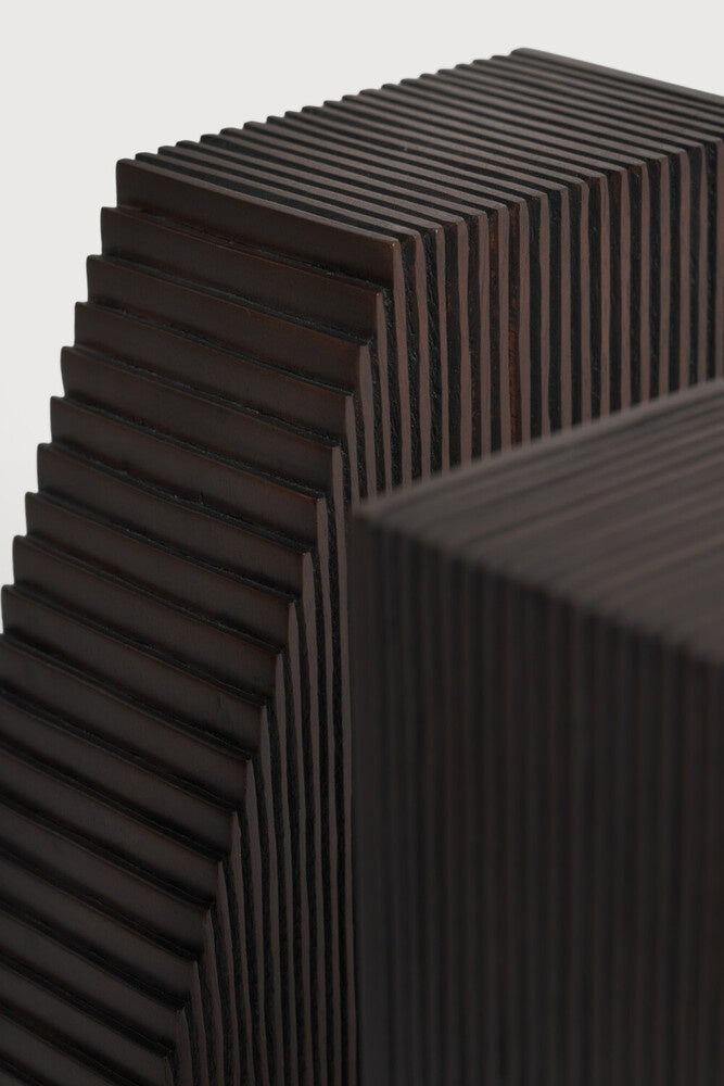 Close-up of a textured black surface with a geometric pattern