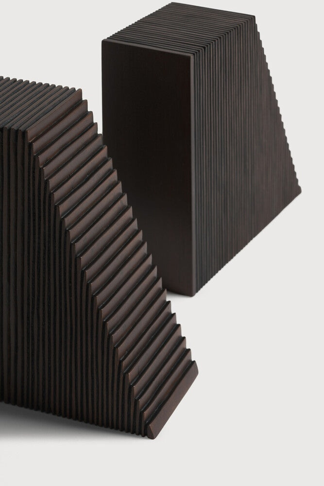 Stack of black acoustic panels on a white background