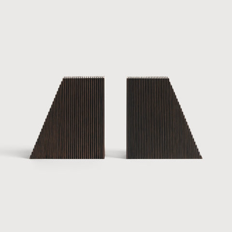 Two black triangular bookends on a light gray background