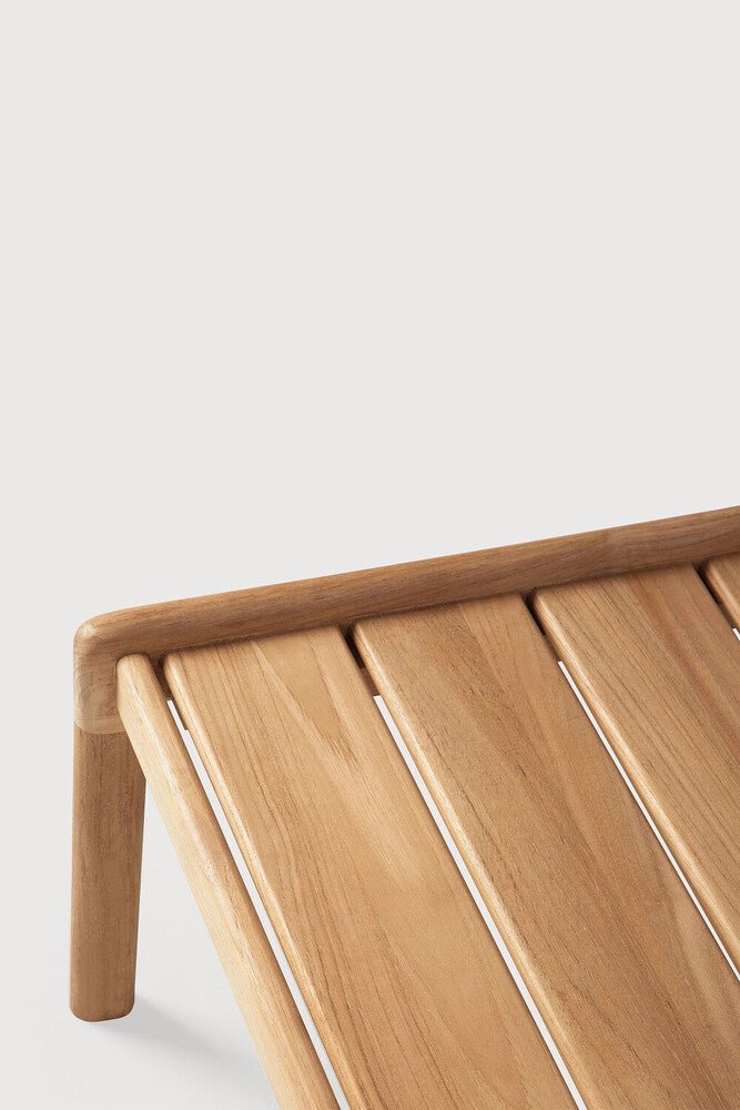 Wooden bench with slatted design on a light gray background