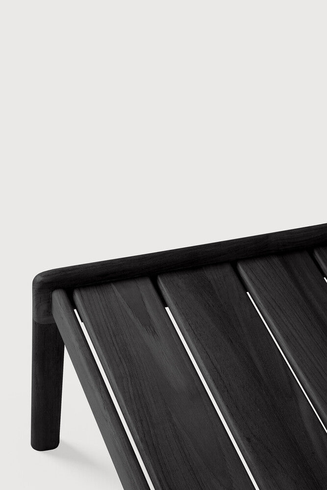 Close-up of a black metal bench with a white background