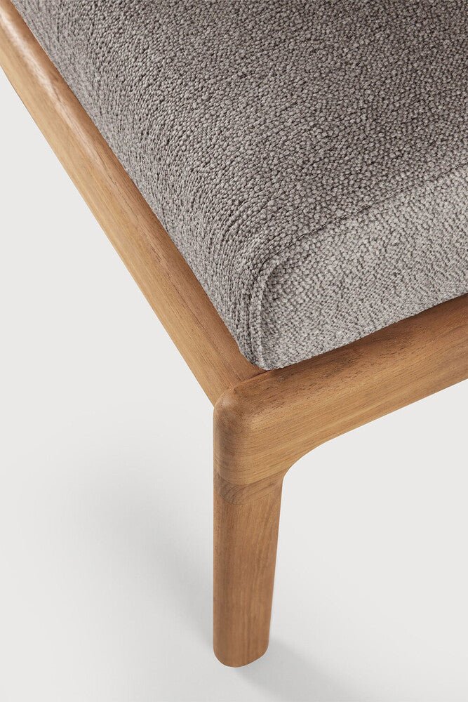 Close-up of a wooden chair with a gray cushion on a white background
