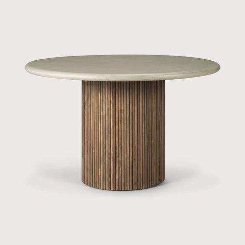 Round table with a light-colored top and wooden base on a white background