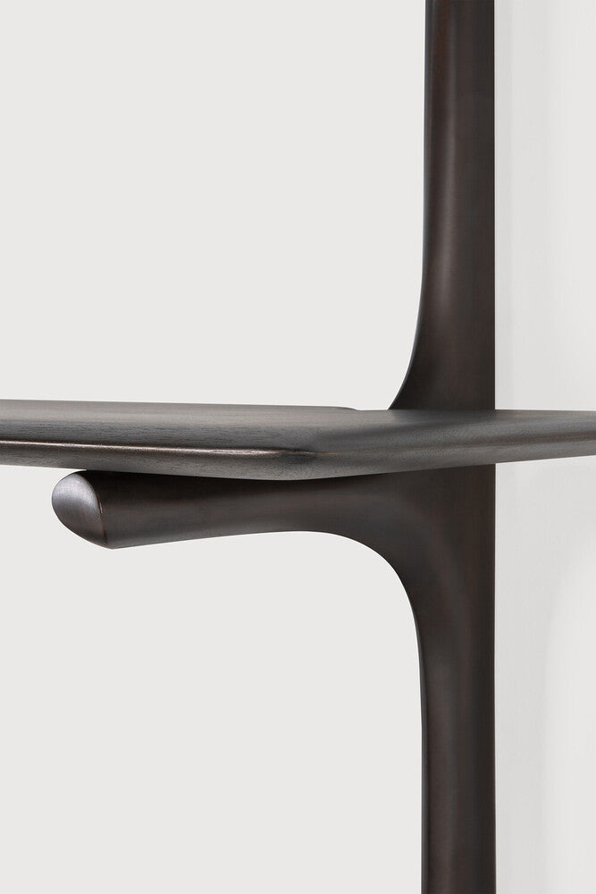Dark brown chair with a minimalist design on a light gray background