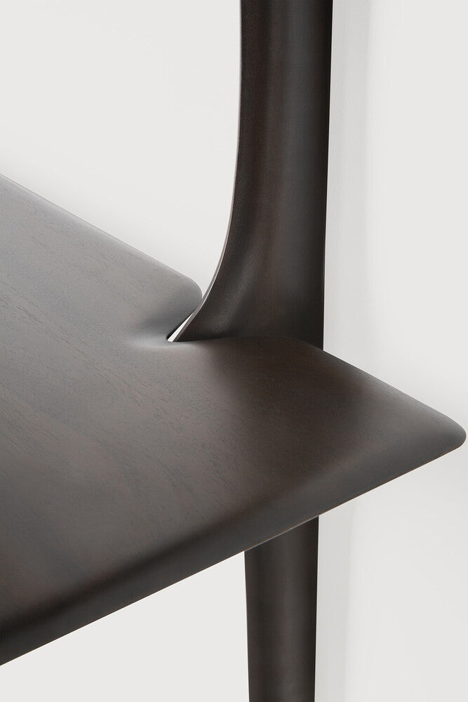 Close-up of a dark wooden chair with a white background