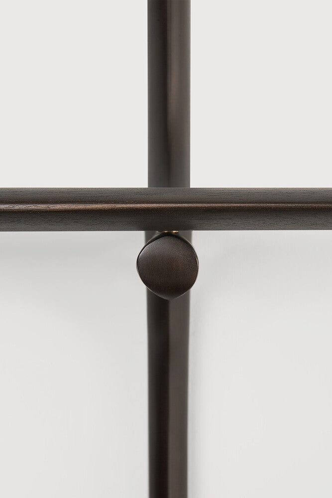 Close-up of a dark metal frame with a knob on a white background